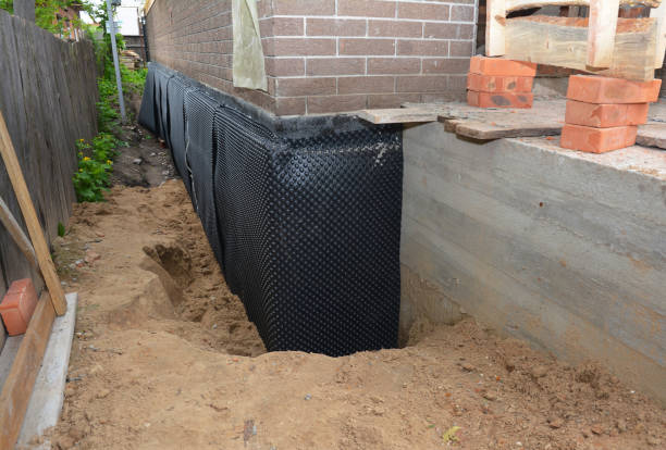 Happy homeowners after waterproofing job in Pipersville